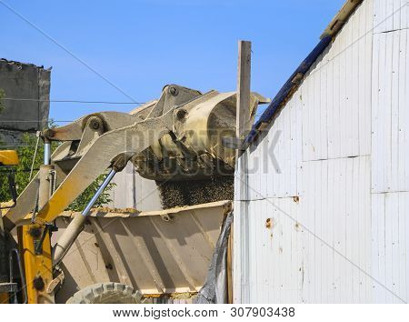 Tractor Collects Scoop With  Gravel. Excavator Extracts Sand And Gravel For  Concrete Mix.
