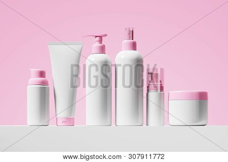 A Set Of White Packages Of Cometary Product. A Jar Of Cream, A Tube Of Gel, Shampoo, Lotion With A D