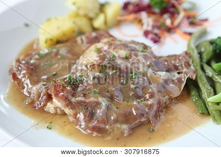 Saltimbocca Pork Steak On A Place In Closeup