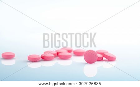 Round Pink Tablets Pill On White Background. Vitamins And Minerals Plus Folic Acid Vitamin E And Zin