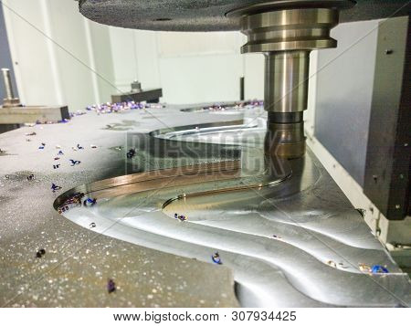 A Process Of Cnc Milling Of Lagre Thick Steel Palte By Curved Trajectory, Selective Focus With Blur 