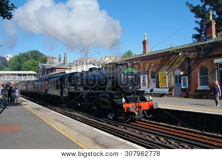 ST. LEONARDS-ON-SEA, ENGLAND - JUNE 22, 2019: London Midland and Scottish Railway Class 5 steam locomotive, 44871, hauls an excursion train. Designed by William Stanier, it was built in 1945.