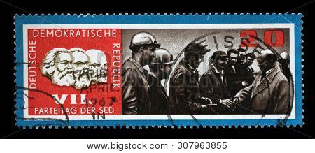 ZAGREB, CROATIA - JULY 03, 2014: A stamp issued in Germany - Democratic Republic (DDR) shows Walter Ulbricht and factory workers, SED Party Day, circa 1967.