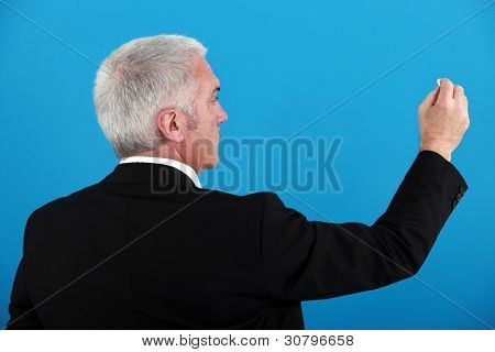 Homme d'affaires, écrit sur un tableau invisible