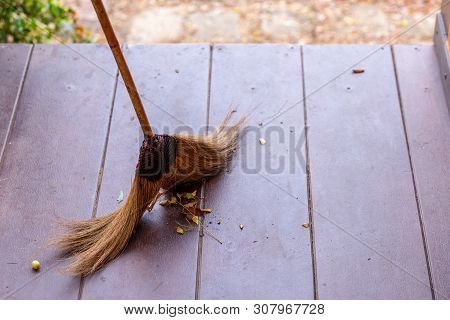 Sweeping Dry Leaves With Broom.fall Season.sweep The Leaves, .maintenance Worker In Park Garden Clea