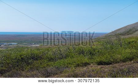 A Hazy View Of Sledge Island Off The Coast Of Nome.
