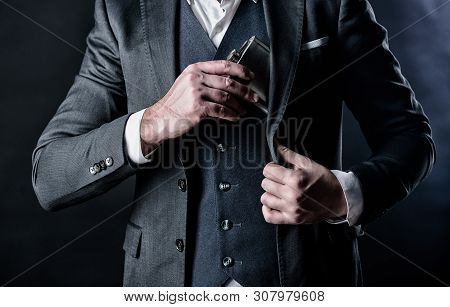 Brandy Drink. Man Drink Alcohol. Male Put Brandy Flask In Pocket. Bachelor And Single. Male Has Bad 