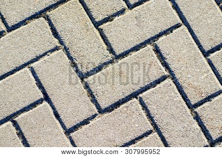 Cobblestone Pavement Abstract Background Texture Old Street. Pavement Texture. Gray Brick Paving Sto