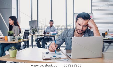 Creative Designer Get Stress While Working With Laptop At Modern Office.workplace Lifesyle Concept