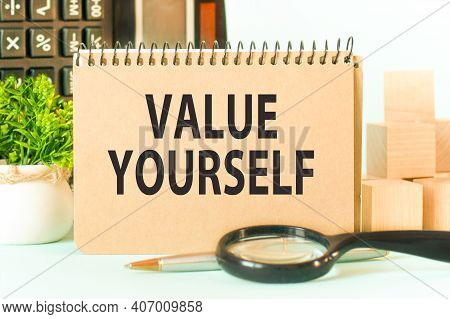 Business Concept. Notebook With Text Value Yourself Sheet Of White Paper For Notes, Calculator, Magn