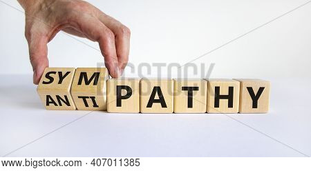 From Antipathy To Sympathy. Businessman Turns Cubes And Changes The Word 'antipathy' To 'sympathy'. 
