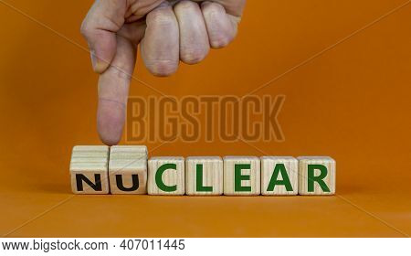 Nuclear Or Clear Symbol. Businessman Turns A Cube And Changes The Word 'nuclear' To 'clear'. Beautif