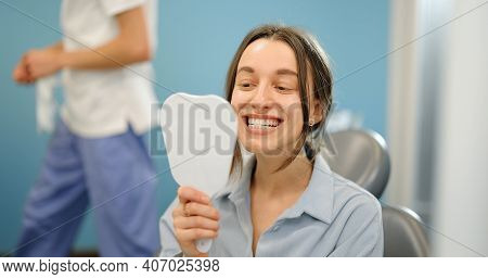 Woman Happy With Haer Teeth At The Dental Office