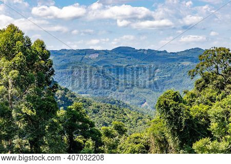 Valley With Forest And Farm Fields