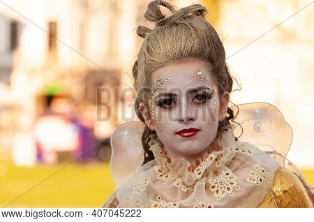 Timisoara, Romania - March 31, 2017: Woman In A Masquerade Costume Dress Posing As A Living Statue A
