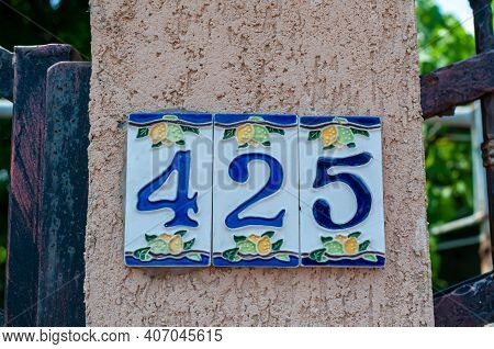 House Number Plate 425 On A Wall. Street Number. Address Number.
