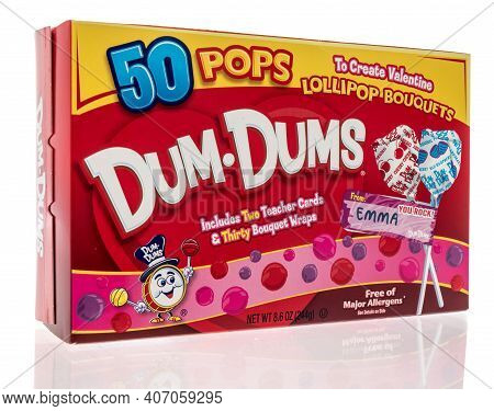 Winneconne, Wi -30 January 2021: A Package Of Dum Dums Lillipop Candy On An Isolated Background.