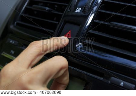 Close Up Hand Press The Emergency Light In The Car, Fingers Press Button.for Open The Contract Emerg