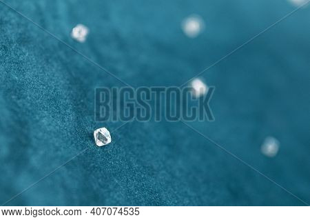 Several Large Diamonds Lie On The Turquoise Velvet. Close-up Photo. Cut Diamond.