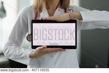 Doctors Hands Are Holding Digital Tablet With Electrocardiogram Closeup. Ecg Diagnostics Of Heart Di