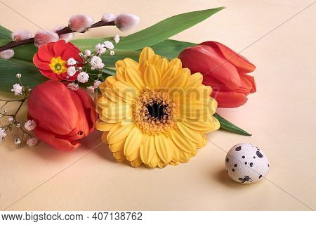 Easter Decorations, Spring Flowers And Quail Egg. Orange Gerbera Daisy, Red Tulips, Pussy Willow, Pr