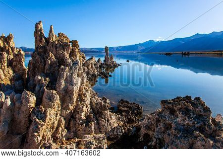 California, USA. Picturesque lake with lime-tuff towers of fancy shape. Dusk. Mono Lake is a natural wonder of the world. The concept of ecological, exotic and photo tourism