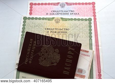 Maikop, Adygea Republic, Russia - February 6, 2021: Russian Passport With Money Invested In It Is Pl