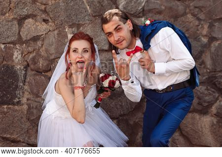 Portrait Of Bride And Groom, Brick Wall Background