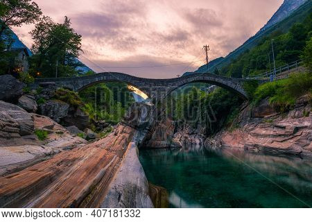 Double Arch Stone Bridge At Ponte Dei Salti In Lavertezzo, Canton Tessin, Switzerland, With The Clea