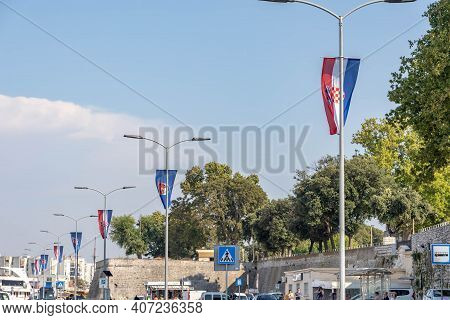 Zadar, Croatia - Aug 13, 2020: Croatia Flag Hang On Lamps By City Harbour