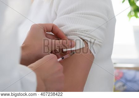 Doctor Injecting Vaccine To Woman, Covid Vaccine