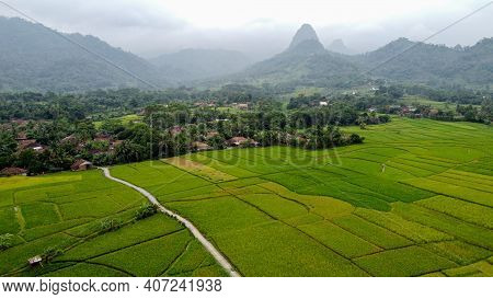 Aerial View Of Rice Fields On Terraced Of Cariu With Noise Cloud After Rain, Bogor, Indonesia. Indon
