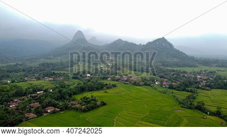Aerial View Of Rice Fields On Terraced Of Cariu With Noise Cloud After Rain, Bogor, Indonesia. Indon