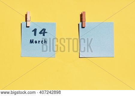 March 14st. Day Of 14 Month, Calendar Date. Two Blue Sheets For Writing On A Yellow Background. Top 