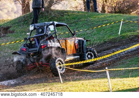 Afipsip, Russia - October 31, 2020: Sportsman Drives Buggy At Mud Racing Contest. Atv Ssv Motobike C