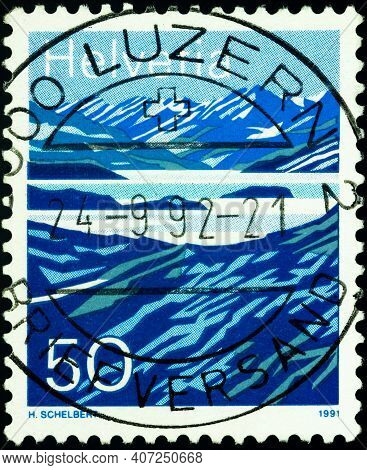 Moscow, Russia - February 08, 2021: Stamp Printed In Switzerland Shows Laghetto Moesola, Lake On San