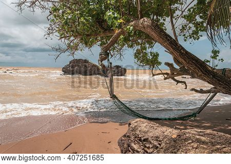 An Abandoned Hammock On An Empty Beach In Axim Ghana West Africa.