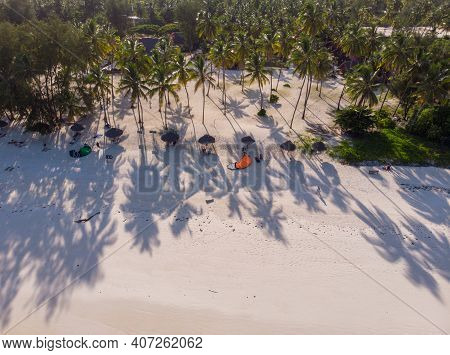 Aerial Top View On Paje Beach With Palm Trees Shadows At Evening Time. Paje Village, Zanzibar, Tanza