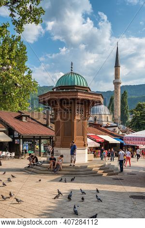 Sarajevo, BiH - August 28, 2019: Bascarsija square with Sebilj wooden fountain in Old Town Sarajevo in Bosnia and Herzegovina