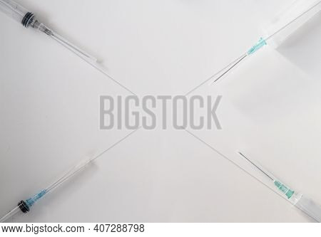 Syringes With Different Volumes On A White Background