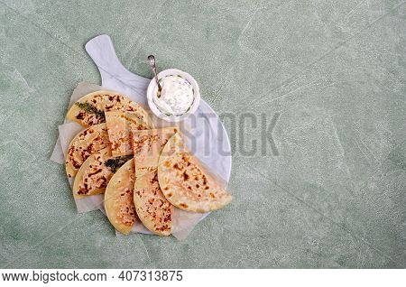 Baked Bread With Vegetable Filling On A Stone Background. Selective Focus.