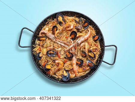Seafood Fideua Isolated From Light Blue Background, Top View