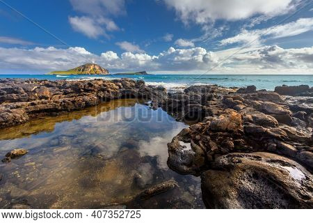 rocks close to Macapuu beach with Manana (also known Rabbit island) and Kaohikaipu islands in background, Oahu, Hawaii