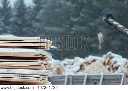 Warehouse Of Wooden Boards, Background Texture Of Wood Harvested For Shipment To The Factory, Finish