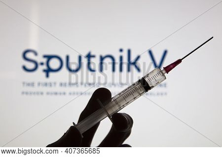 Oxford, Uk - February 2020: Sputnik V Covid Vaccine Logo With Injection Syringe