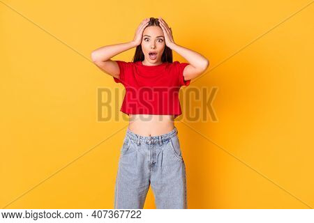 Photo Of Shocked Terrified Lady Hands On Head Open Mouth Wear Red Crop Top Jeans Isolated On Bright 