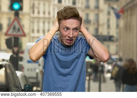 Teenagers Having Nervous Breakdown. Crying European Boy Is Closing His Ears With His Hands. Young Bo