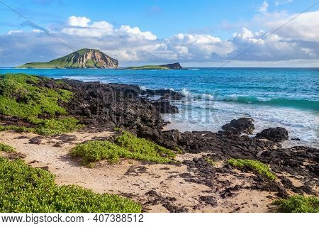 rocks close to Macapuu beach with Manana (also known Rabbit island) and Kaohikaipu islands in background, Oahu, Hawaii