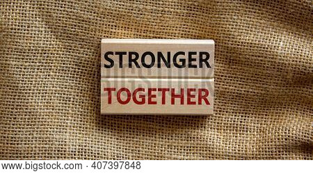 Stronger Together Symbol. Concept Words 'stronger Together' On Wooden Blocks On A Beautiful Canvas B