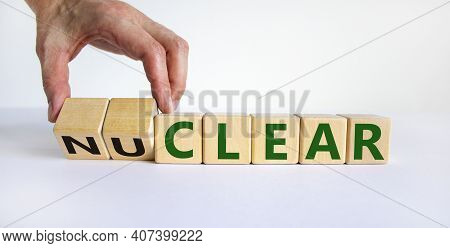 Nuclear Or Clear Symbol. Businessman Turns A Cube And Changes The Word 'nuclear' To 'clear'. Beautif